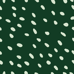 Vector seamless pattern with white paint drops on dark green background. 