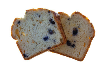 Slices of fresh blueberry cream cake on a white background.