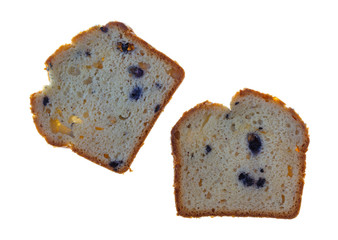 Slices of fresh blueberry cream cake on a white background.