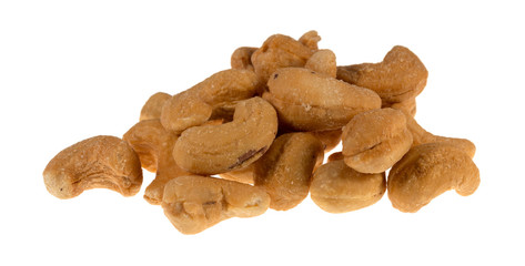 Roasted and salted cashews on a white background.