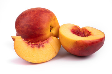 Side view of sliced juicy organic nectarine on white background