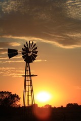 Kansas Windmill at Sunset with colorful sky and cloud's.