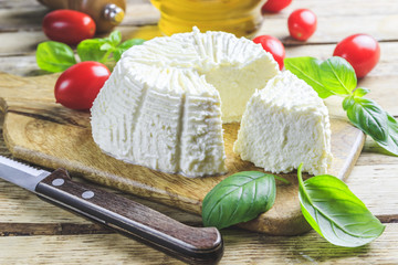Fresh ricotta cheese with basil