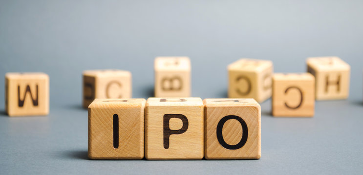Wooden blocks with the word IPO (Initial public offering; stock market launch). The first public sale of shares of a joint stock company. Business and finance concept