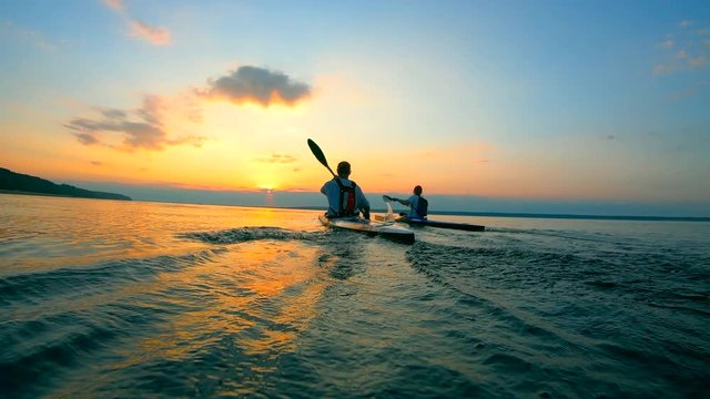 Canoeing race held at the sunset lake