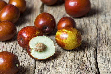 Obraz premium Fresh ripe jujube fruits on wooden rustic background. Healthy fruit cleans blood, contains vitamin c ( Ziziphus zizyphus )
