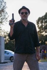 criminal with hat and gun replica