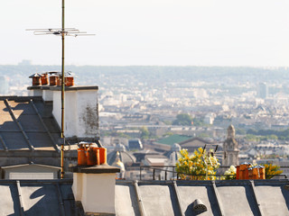 Paris roofs, overview at summer day, Montmartre, France