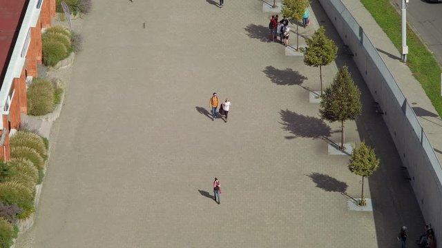 Zlin, Czech Republic - September 2019: Evated view of people walking on pedestrian sidewalk. 4K resolution