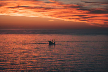 Fototapeta na wymiar Ship at Sunset