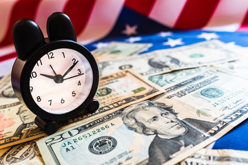 American retirees have little time to enjoy their pension and savings, a retirement background concept with an alarm clock.