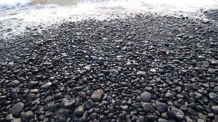 Rocky Textured Beach with Waves Crashing In