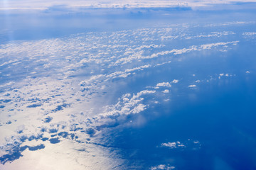 Sea of blue and white clouds seen from above.