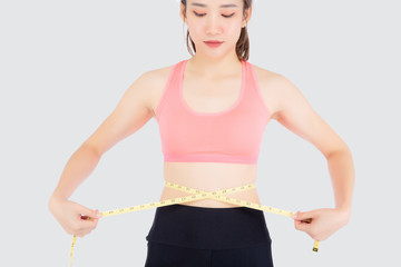 Beautiful slim young asian woman measuring tape thin waist wear uniform fitness isolated white background, asia girl loss weight for diet with exercise and workout wellbeing and healthy care body.