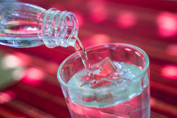 pouring drinking water into a glass