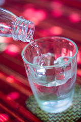 pouring water into a glass
