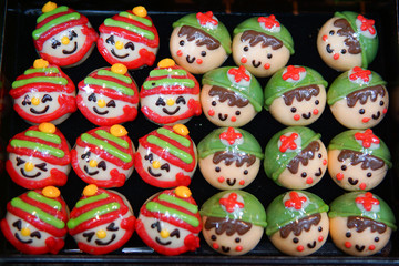 Chocolates in different shapes and sizes sold in open food market.