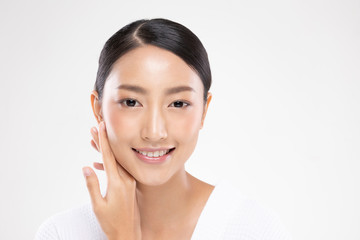 Beautiful Asian young woman touching soft cheek smile with clean and fresh skin Happiness and...