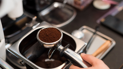 Coffee powder on coffee tamper