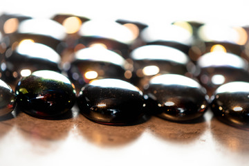 Flat marbles in a row with a back light