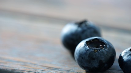 clos eup view on fresh blueberries on wooden surface