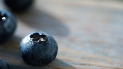 blueberries on wooden surface