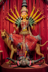 Idol of Goddess Devi Durga at a decorated puja pandal in Kolkata, West Bengal, India. Durga Puja is...