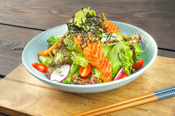 Salmon Salad Japanese style on wood table.Healthy Concept