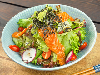 Salmon Salad Japanese style on wood table.Healthy Concept.Close up.