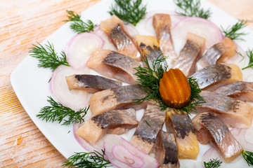 Fototapeta na wymiar Fillet herring with dill and lemon