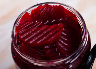 Glass jar with pickled red beets