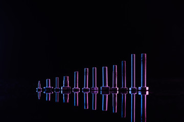 shiny purple metallic bolts isolated on black