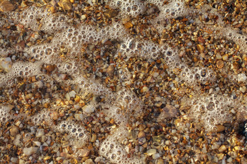 sea pebbles colored granite on the beach