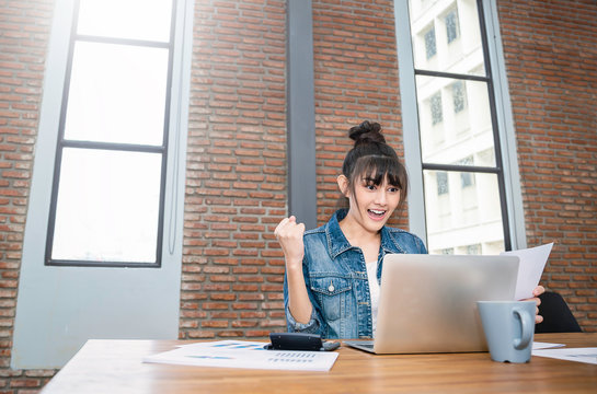 Portrait of smiling beautiful business asian woman working in office desk using computer with copy space. Successful business people employee, freelance online marketing concept