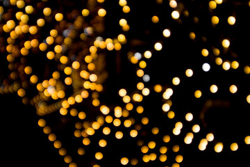 golden bokeh on a black background,blurred garland light