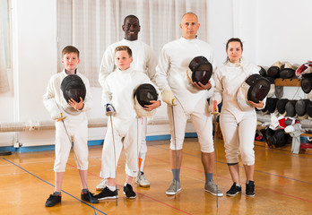 Portrait of happy mixed age group of athletes