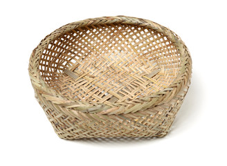 Fototapeta premium Bamboo basket hand made isolated on white background. Woven from bamboo tray.