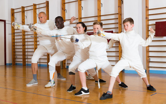 fencers posing with rapiers