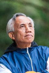 Asian male senior portrait looking confident