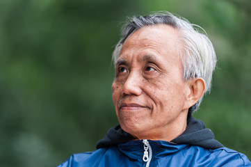 Smiling Asian male senior