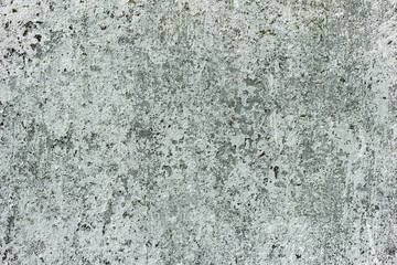 Texture of a concrete wall with cracks and scratches which can be used as a background