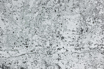 Texture of a concrete wall with cracks and scratches which can be used as a background