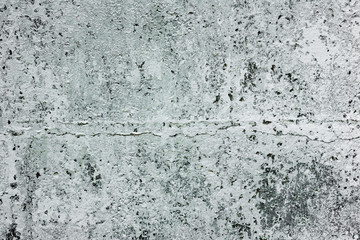 Texture of a concrete wall with cracks and scratches which can be used as a background