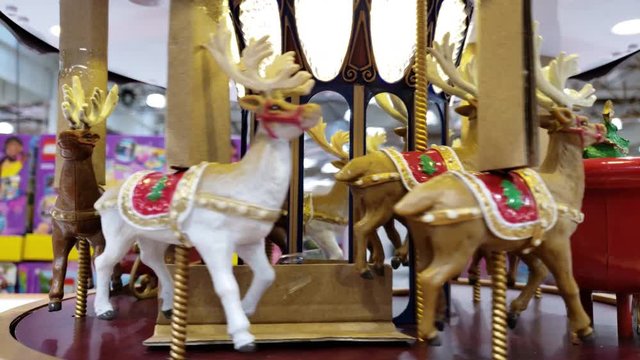 Christmas theme carousel holiday decoration going in circle