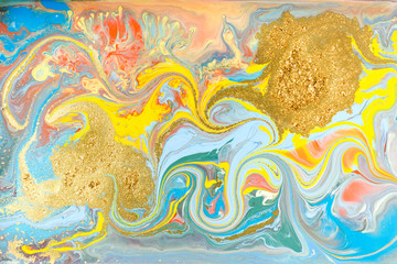 Obraz na płótnie Canvas Blue and yellow marble pattern with golden glitter. Abstract liquid background