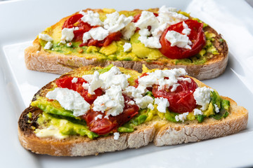 Avocado toast with goat cheese, sun-dried tomatoes