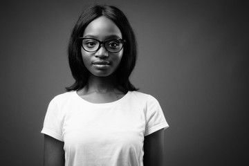 Young beautiful African Zulu woman against brown background