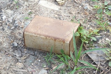 old dirty rusty bucket on dry crack soil