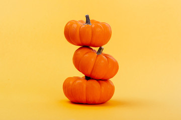 Halloweeen theme with a pumpkins on a yellow background