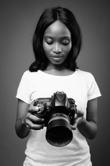 Young beautiful African Zulu woman against brown background